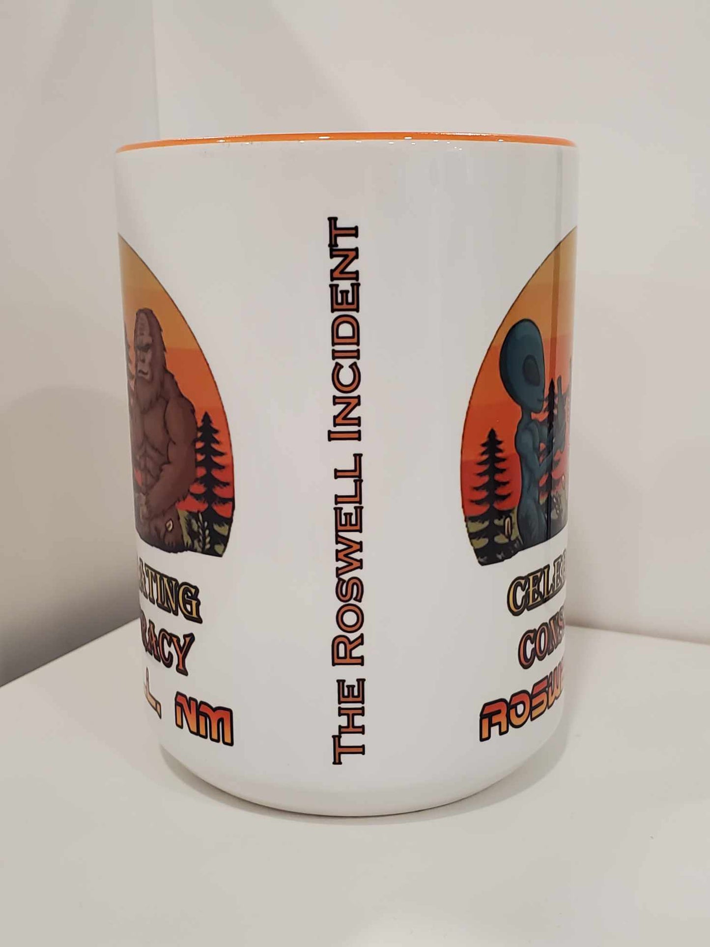Celebrating Conspiracy Bigfoot Alien Cheers 15oz Coffee Mug Orange